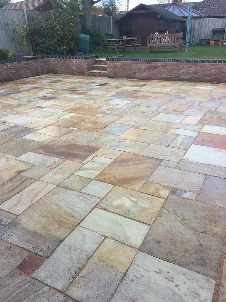 Multi-colored stone patio cleaned and sealed