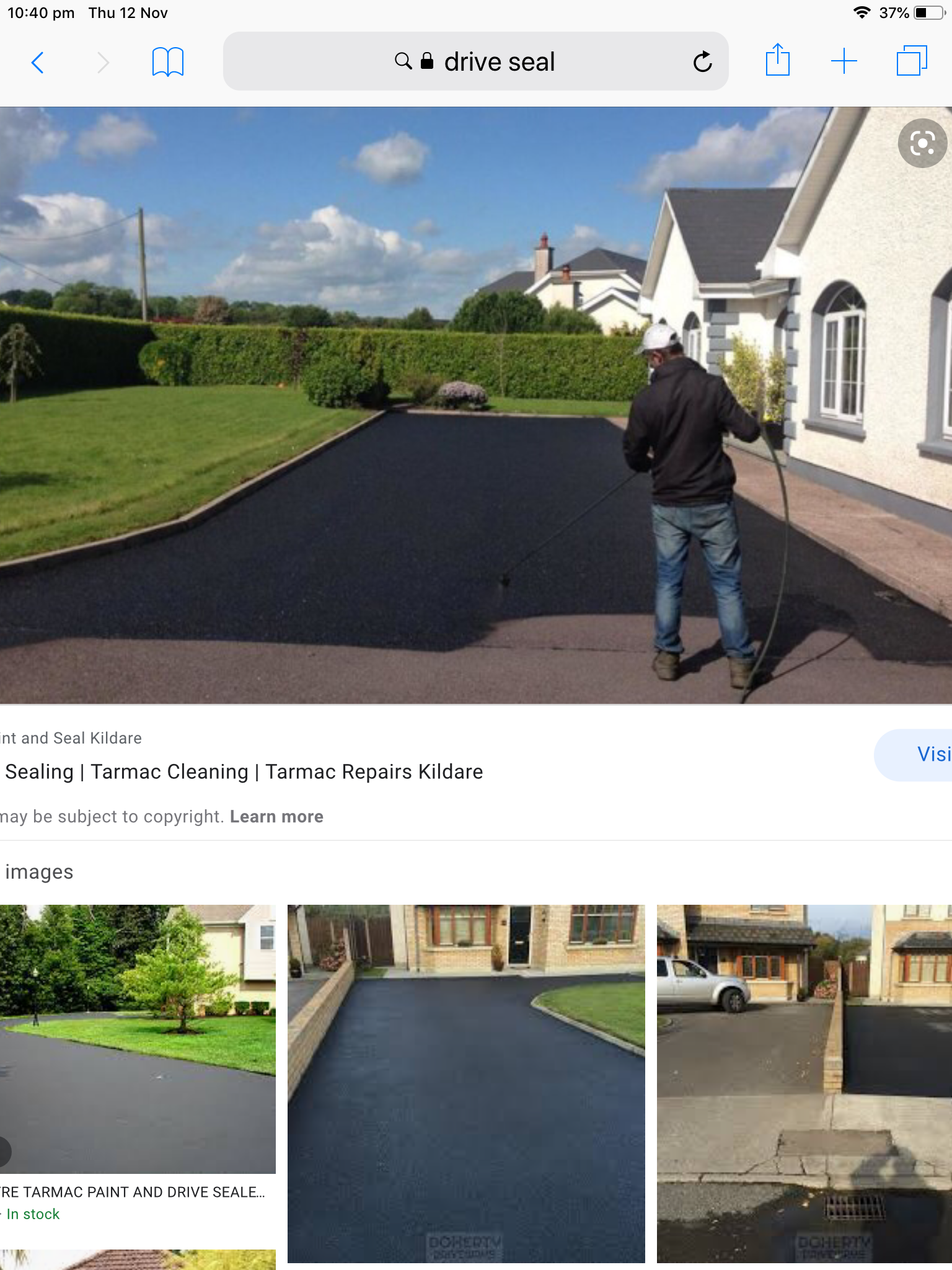 Driveway sealing professional service in progress