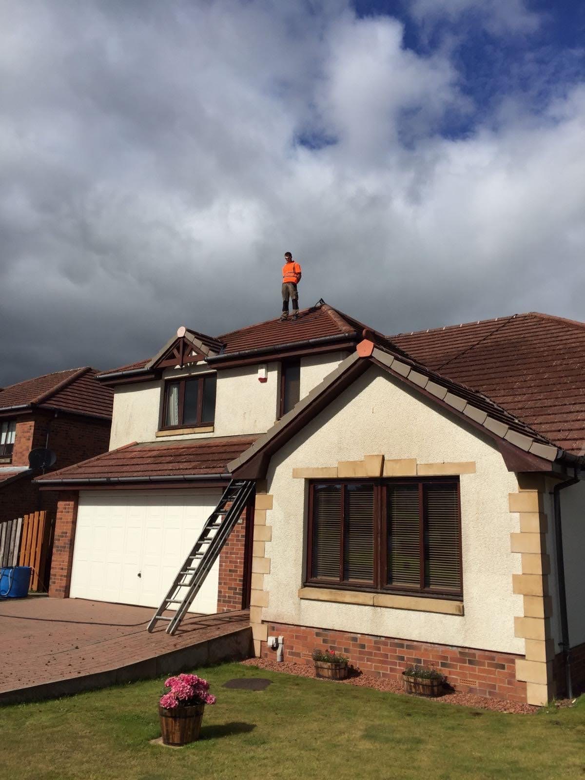 Roof cleaning professional on site
